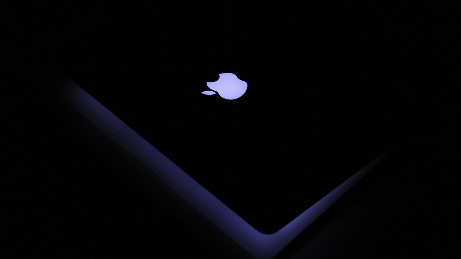 An illuminated Apple logo